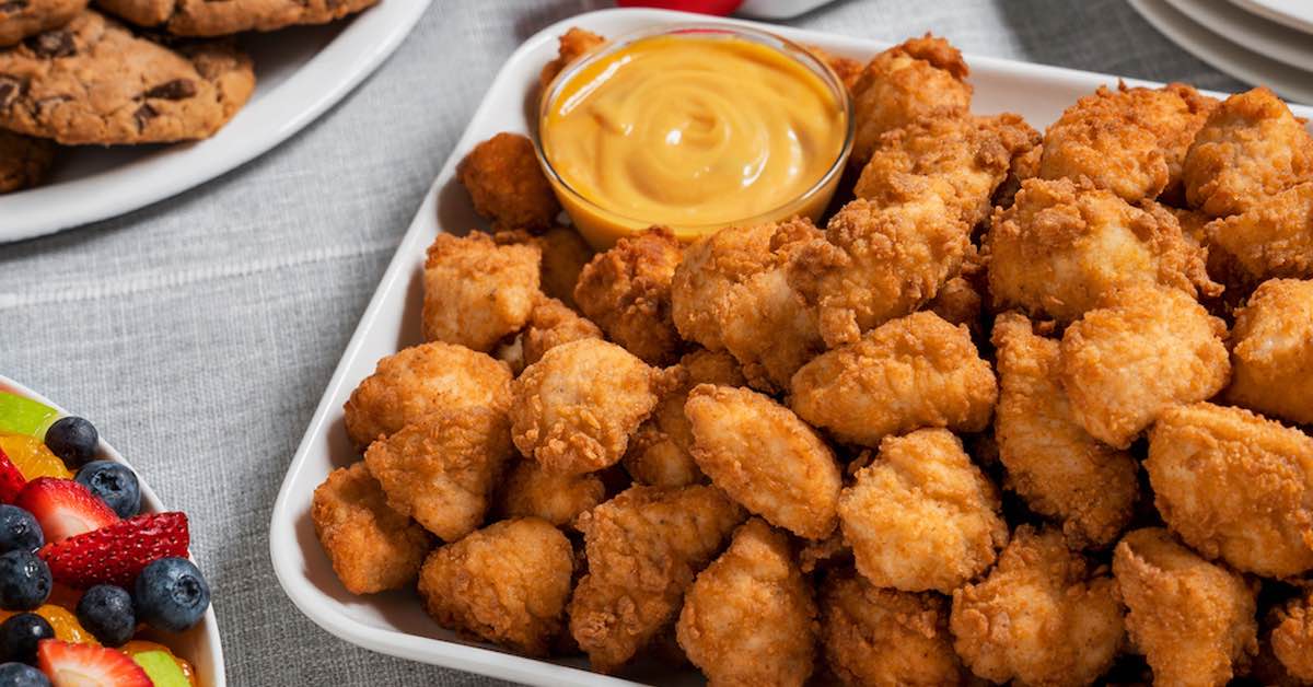 https://d3n2401vhvcfv5.cloudfront.net/_images/company/Chik fil A/1736885048316-Catering Lifestyle Image - Chick-fil-A® Nuggets Tray 2 1_master-2.jpg